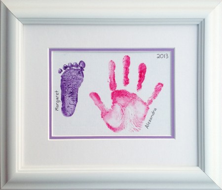 Framed hand and footprint.