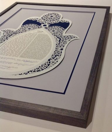 A custom framed papercut Ketubah