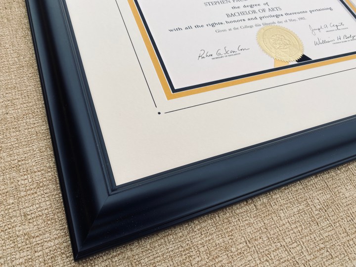 Custom framed college diploma with embellishment