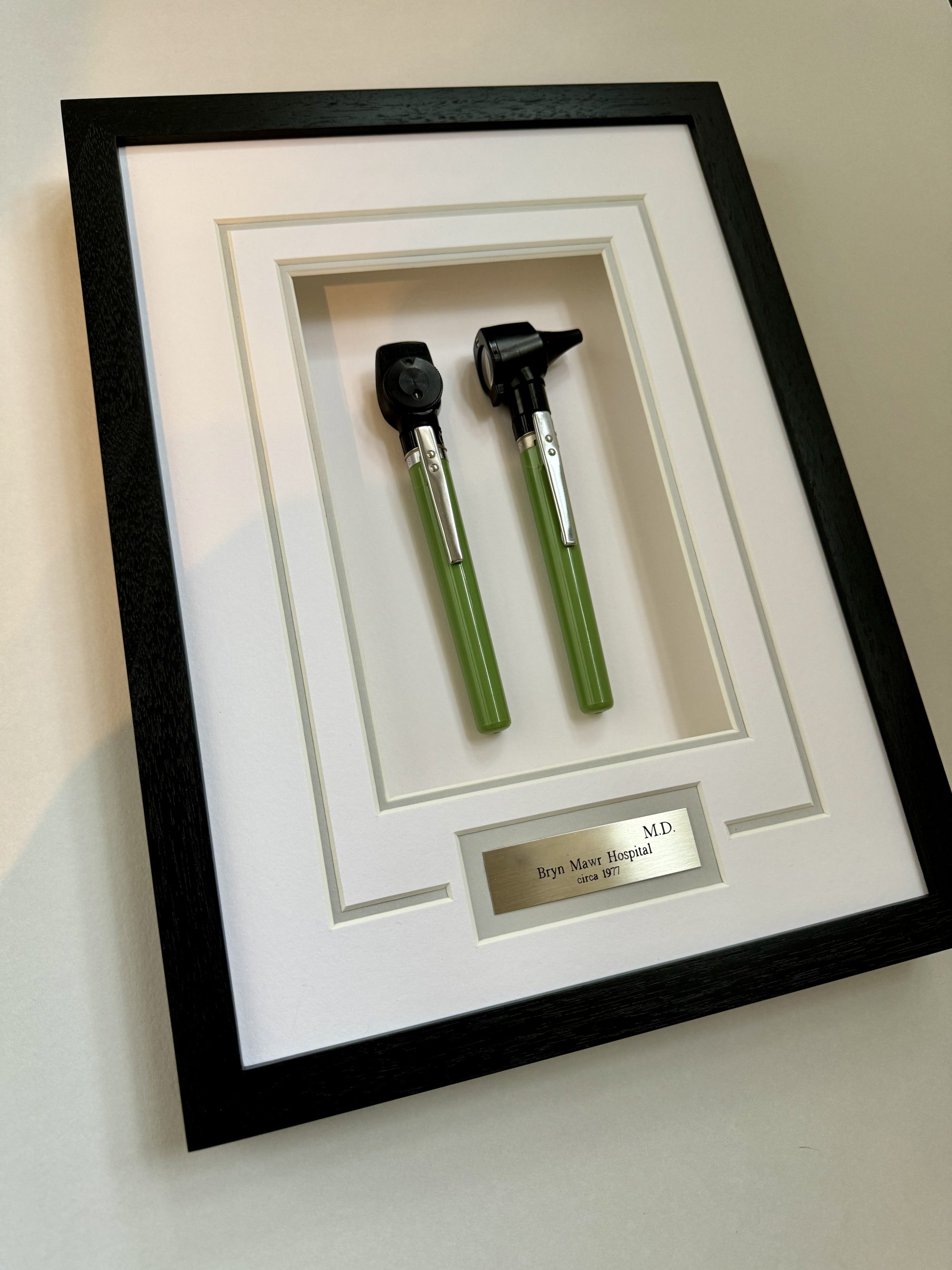 Vintage medical tools framed in a custom shadowbox for a doctor