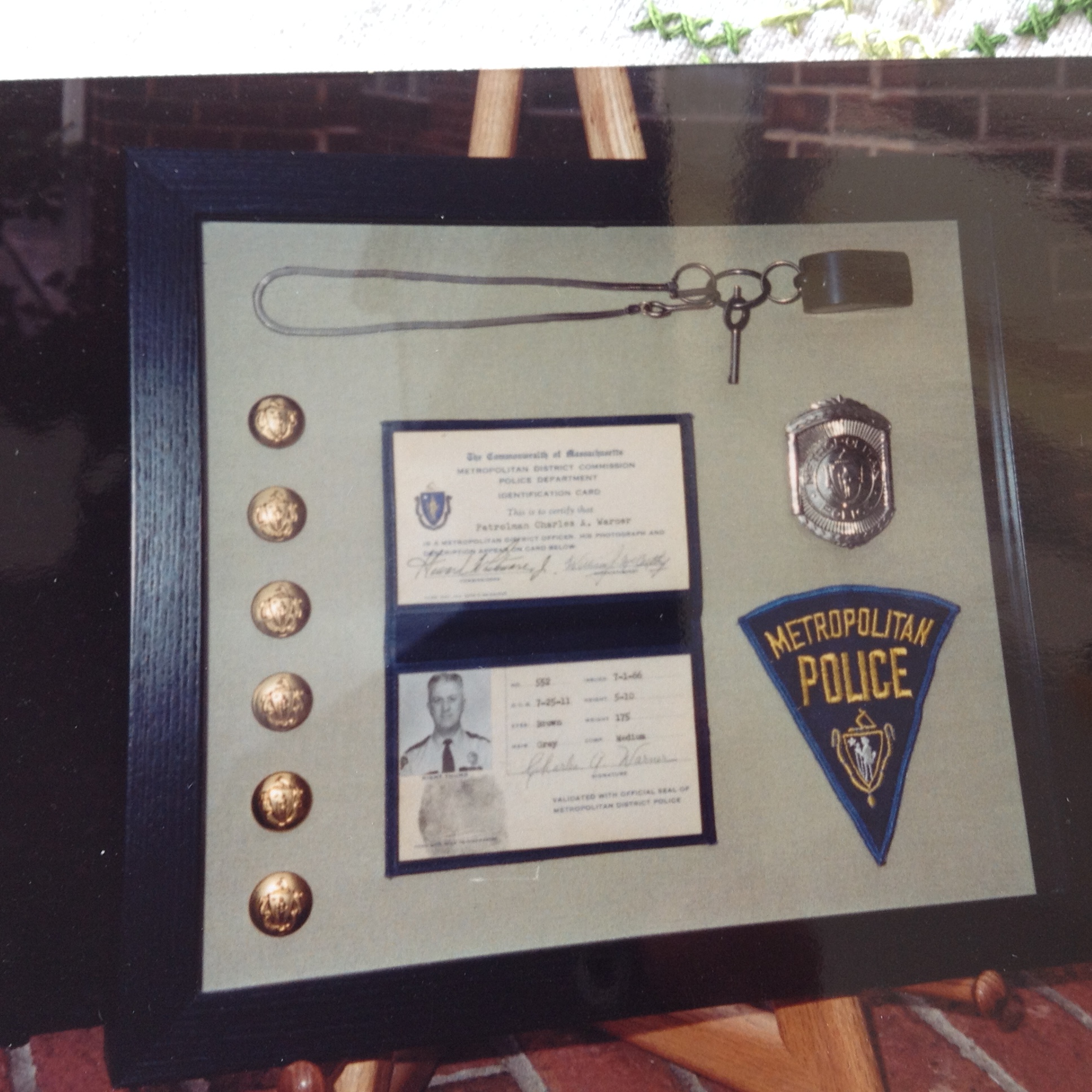 Police Shadowbox with buttons, whistle, identification, badge and patch.