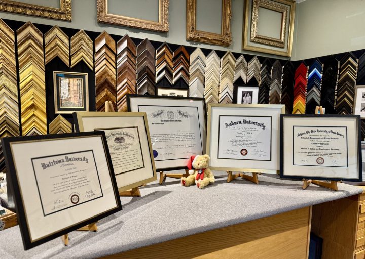 A display of five diplomas showing custom framing.